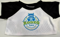 A white t-shirt with a black sleeve and a graphic design featuring a truck and the text "Rodeo Skills Competition" printed on it.
