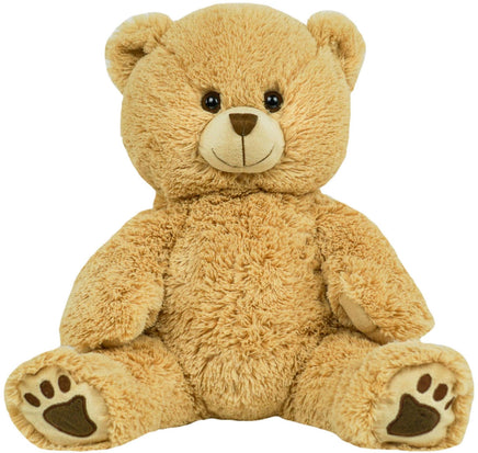 A large, light brown teddy bear sitting on its hind legs with its front paws resting on the ground.