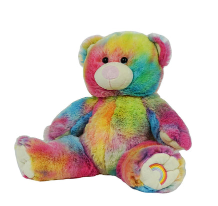 A colorful, tie-dye stuffed teddy bear with a rainbow pattern on its fur.