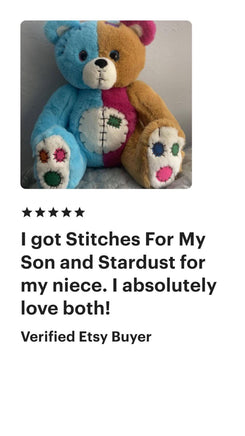 A stuffed teddy bear with a blue and brown color scheme, featuring a patchwork design on its chest and paws. The teddy bear is sitting on a gray surface, and there is a rating and comment from a verified eBay buyer.
