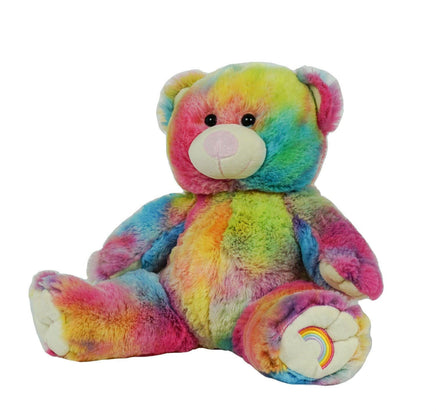 A colorful, tie-dye stuffed teddy bear with a rainbow pattern on its fur.