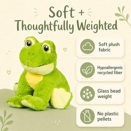 a green plush frog toy with a yellow belly, sitting on a green surface.