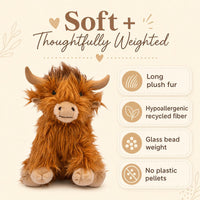 a plush toy of a furry animal, likely a yak or a similar creature, sitting on a light background.