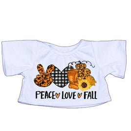 A white t-shirt with a printed design featuring a peace sign, a pumpkin, a sunflower, and the text "PEACE * LOVE * FALL".