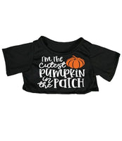 A black t-shirt with a pumpkin graphic and text that reads "I'm the cutest pumpkin in the patch".