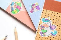 a collection of colorful stickers featuring cartoon unicorn illustrations.