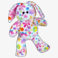 A colorful, multicolored stuffed rabbit toy with a pattern of flowers and spots on its body.