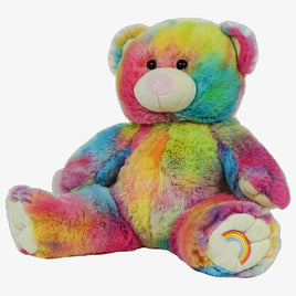 A colorful, tie-dye teddy bear with a rainbow pattern on its fur.