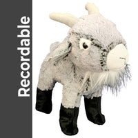 A plush toy of a goat with black legs and feet, standing upright and facing the camera.