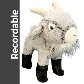 A plush toy of a goat with black legs and feet, standing upright and facing the camera.
