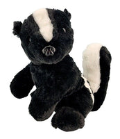 A plush toy of a black and white skunk is shown against a white background.