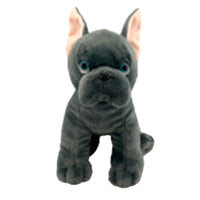 A plush toy of a black dog with large ears and blue eyes.