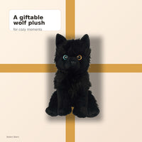 A plush black wolf toy is sitting on a yellow diagonal line against a beige background.