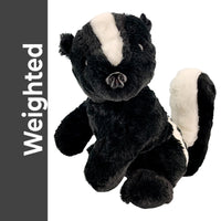 A plush toy of a skunk, with a black and white color scheme, is shown against a white background.