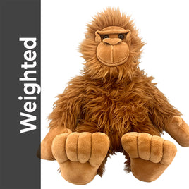 A stuffed toy monkey with a furry brown appearance and large eyes is sitting on a white background.