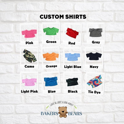 a collection of custom t-shirt designs, each with a different color and pattern, arranged in a grid against a white brick wall background.