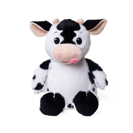 A stuffed cow toy with black and white spots and a pink tongue sticking out.
