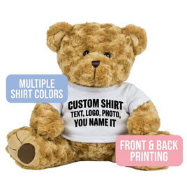 A brown teddy bear wearing a white t-shirt with text printed on it.