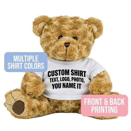A brown teddy bear wearing a white t-shirt with text printed on it.