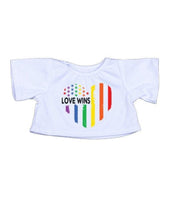 A white t-shirt with a graphic design featuring a heart shape with rainbow stripes and the text "LOVE WINS" printed on it.
