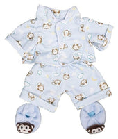 A pajama set featuring a light blue top with a monkey pattern and matching shorts, along with blue monkey slippers.