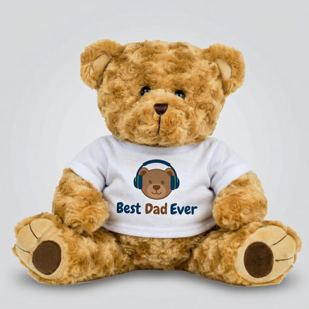 A brown teddy bear wearing a white t-shirt with the text "Best Dad Ever" printed on it.