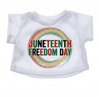 A white t-shirt with the text "JUNEEENTH FREEDOM DAY" printed on it.