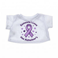 A white t-shirt with a purple ribbon and stars printed on it, along with the text "Someone I Love Has Alzheimer's".