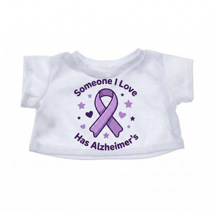 A white t-shirt with a purple ribbon and stars printed on it, along with the text "Someone I Love Has Alzheimer's".