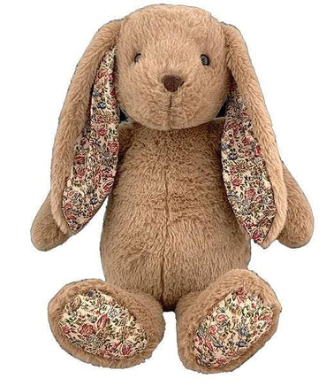 A brown stuffed bunny toy with floral patterns on its ears and feet.