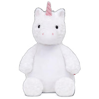 A white plush unicorn toy with a pink horn and tail.