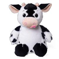 A stuffed cow toy with a black and white pattern and pink accents.