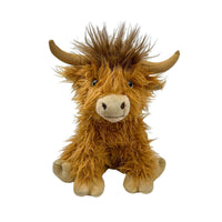 May include: A plush brown Highland cow toy with a fluffy brown coat, a brown nose, and brown horns. The toy is sitting with its legs tucked underneath it.