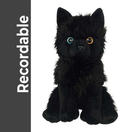 A black plush toy dog with large, expressive eyes and a fluffy, furry appearance.