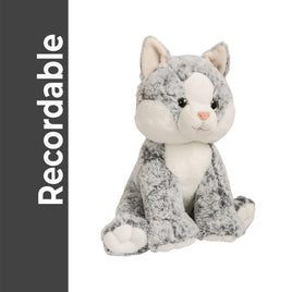 A plush gray and white cat toy is sitting on a white background.