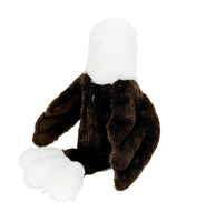 A stuffed toy eagle with a white head and brown body.