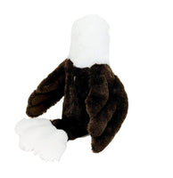 A stuffed toy eagle with a white head and brown body.