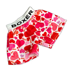 A pair of colorful shorts with a heart pattern, featuring the word "BOXER" printed on them.