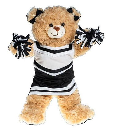 A teddy bear wearing a cheerleader outfit with black and white stripes.
