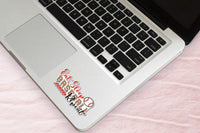 a laptop with a sticker on the palm rest area.