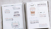 The image is an open spiral-bound notebook with various coffee-related stickers and illustrations on the pages.
