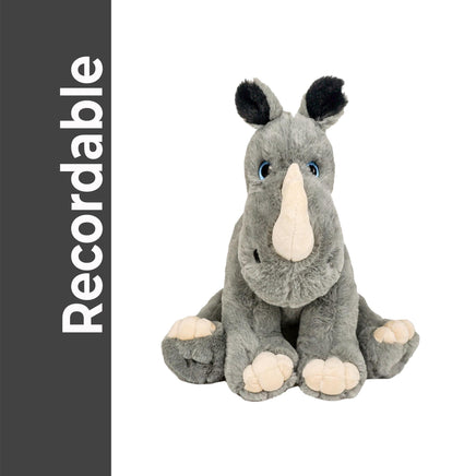 A plush toy rhinoceros with a gray and white color scheme and large, expressive eyes sits on a white background.