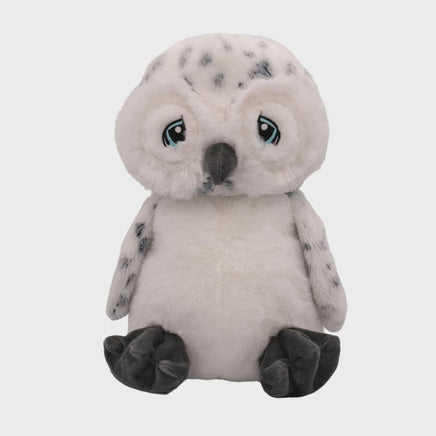 A plush toy of a white owl with blue eyes and gray markings on its body and legs.