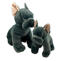 Two large stuffed dogs, one adult and one smaller, are sitting next to each other against a white background.