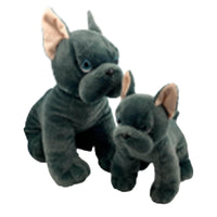 Two plush toy dogs of the same size and color, one larger and one smaller, sitting together against a white background.
