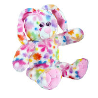 A colorful, tie-dye stuffed bunny toy with a vibrant, multicolored pattern.