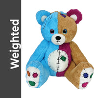 A stuffed toy bear with a blue and brown color scheme, featuring a patchwork design and colorful details on its feet and chest.