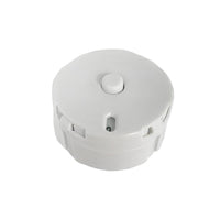 A white, circular object with a small button on top, sitting on a white background.