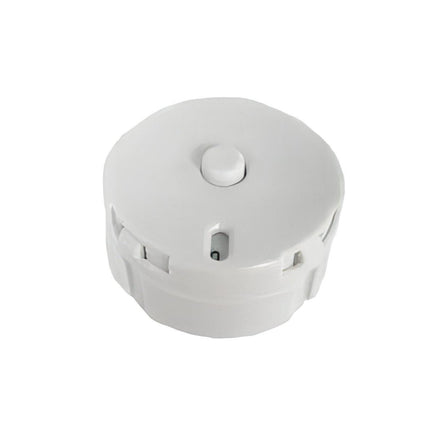 A white, circular object with a small button on top, sitting on a white background.