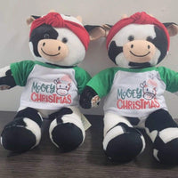 Two stuffed teddy bears sitting next to each other, wearing Christmas-themed shirts and red bandanas.